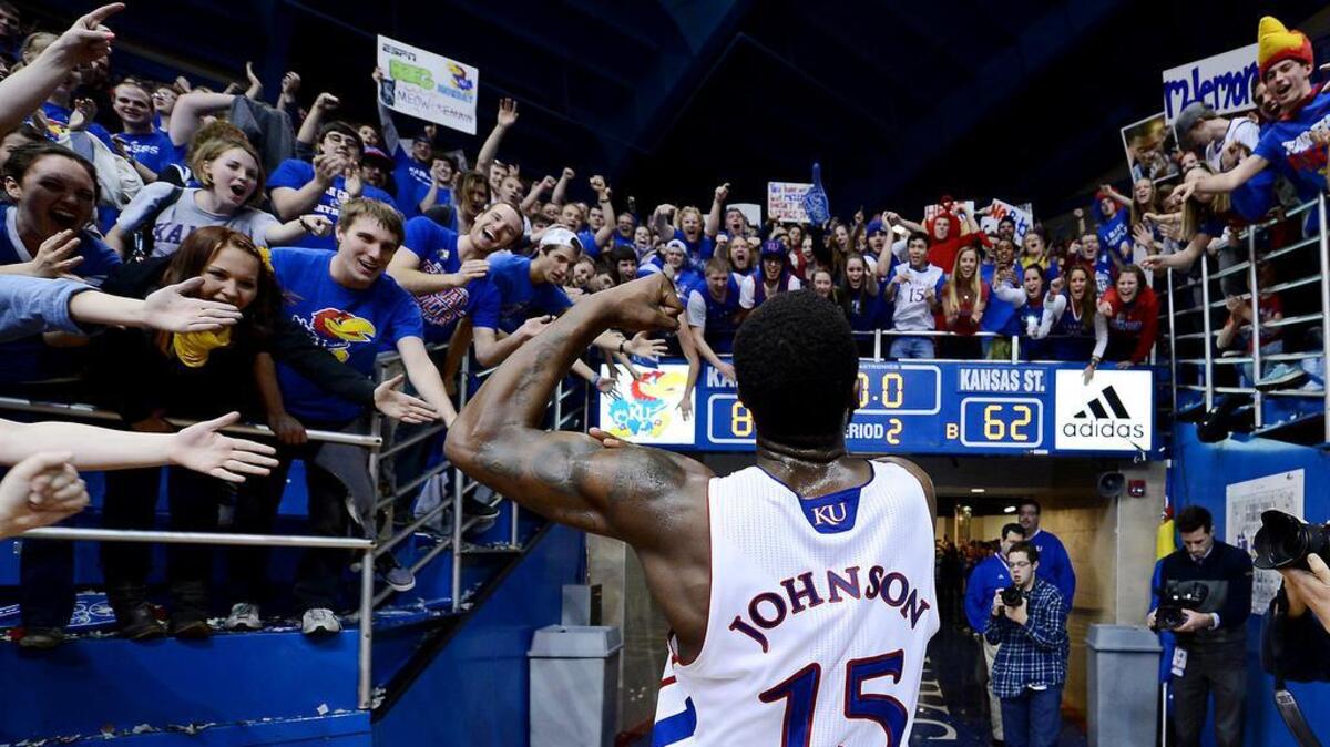 Elijah Johnson and the Kansas Jayhawks flexed a little muscle in their convincing win over rival Kansas State on Feb. 11, 2013 at Allen Fieldhouse. KU snapped a three-game losing streak with the 83-62 win over the Wildcats. Johnson celebrated with his classmates on his way off the floor.