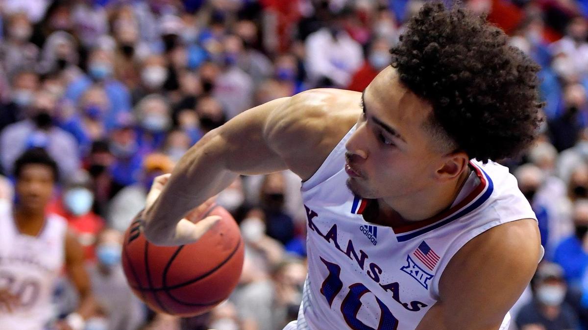 In this file photo, KU’s Jalen Wilson kicked a pass to teammate Ochai Agbaji, who made a three-pointer during a Big 12 victory over Baylor this season in Lawrence.