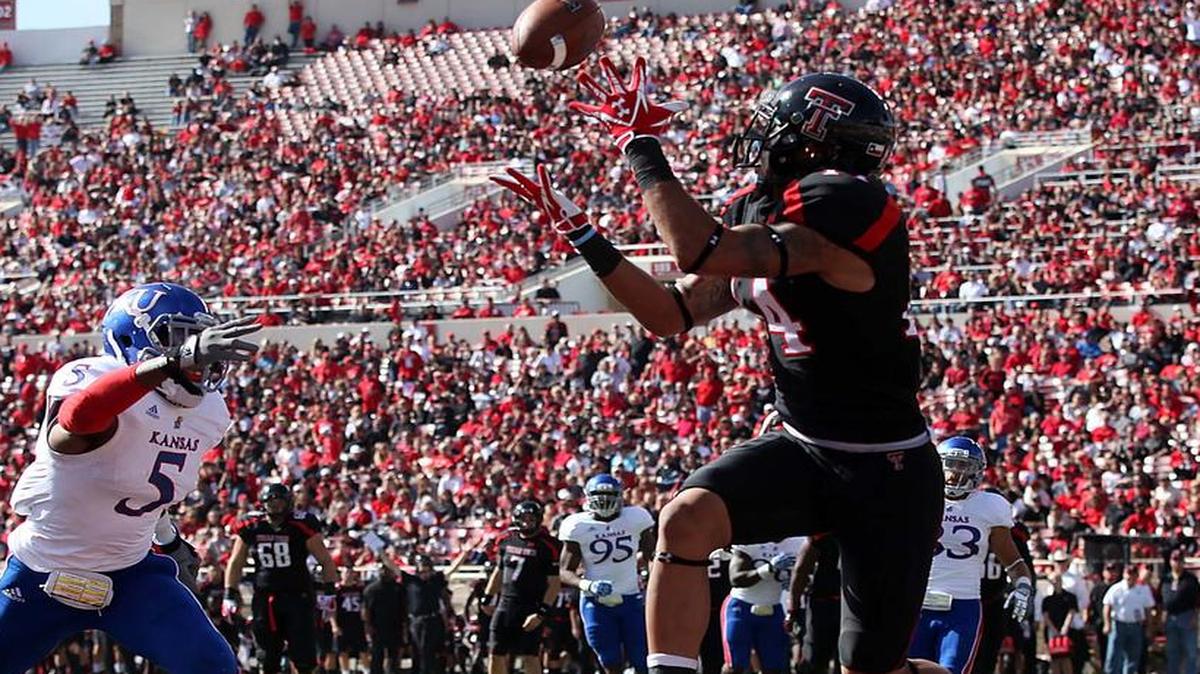 
Texas Tech piled up points with the Air Raid offense and now KU is going to try its version.
