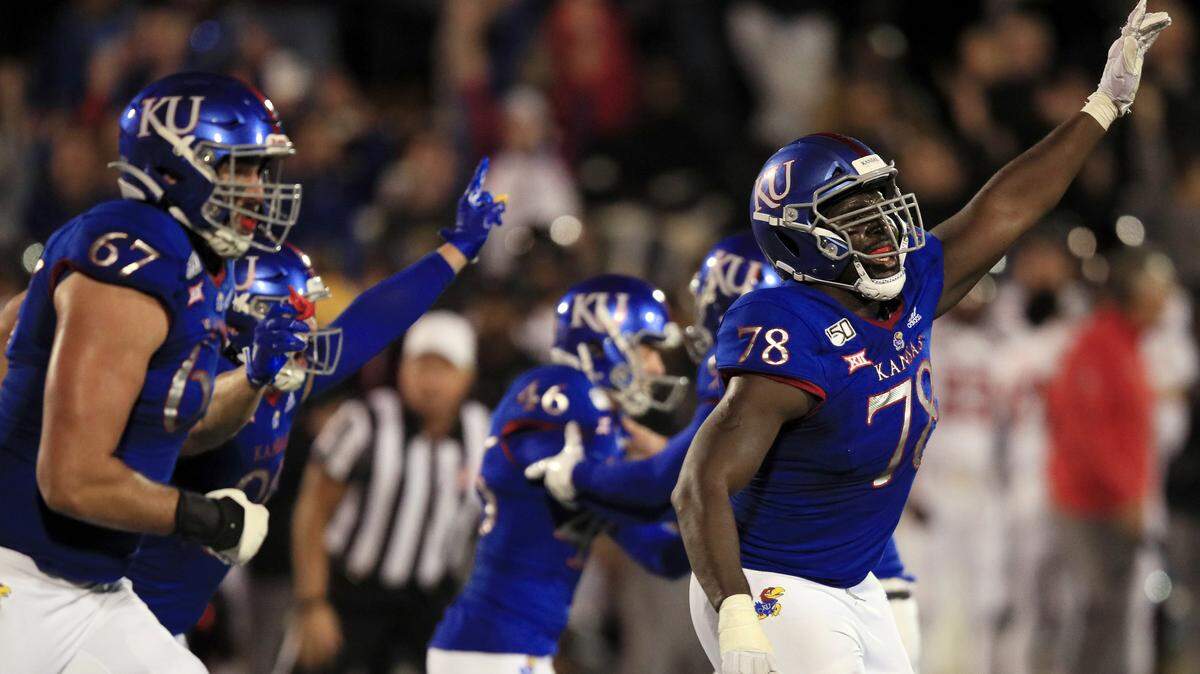 Kansas offensive lineman Hakeem Adeniji (78) celebrates a game-winning field goal at the end of a college football game against Texas Tech in Lawrence on Saturday. KU defeated Texas Tech, 37-34.