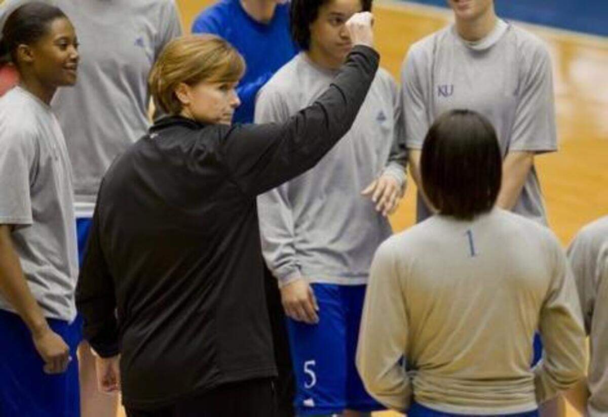 
University of Kansas women’s basketball coach Bonnie Henrickson (center) was fired Monday after 11 seasons at KU. The Jayhawks finished under .500 in each of the past two seasons.

