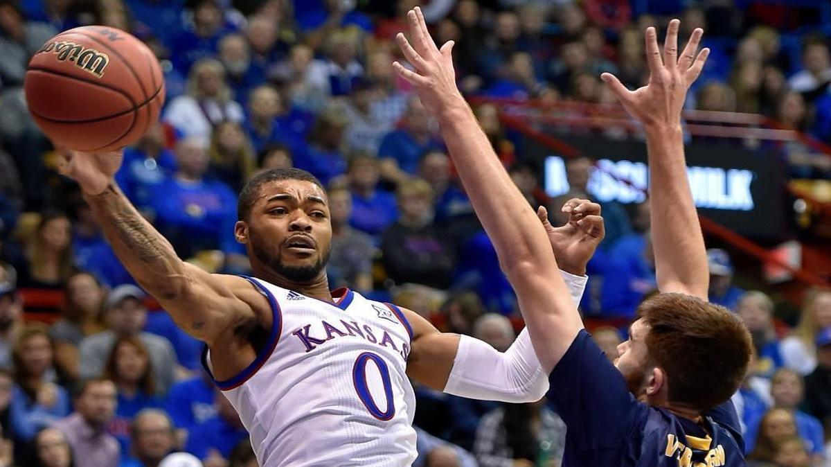 KU’s Frank Mason (left) flung a pass around Northern Colorado’s Jeremy Verhagen during the first half Friday night at Allen Fieldhouse.