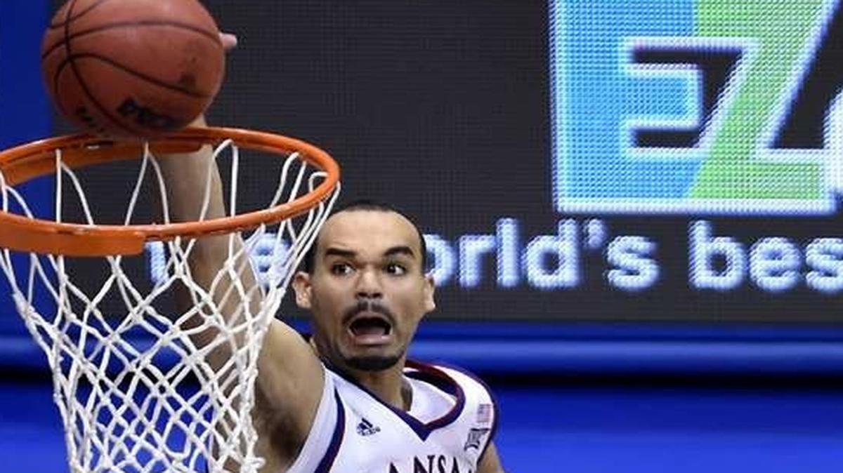 KU’s Perry Ellis (left) is used to working inside, but he may see more action on the outside.
