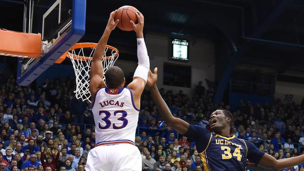 KU's Landen Lucas took an alley-oop pass out of the air and flew past Cal Irvine's 7'-6'' Mamadou Ndiaye for a dunk during the first half of Tuesday night's game at Allen Fieldhouse.