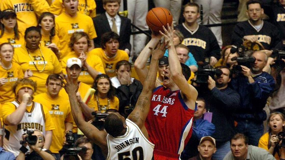 KU’s David Padgett scores the game-winning shot over Missouri’s Arthur Johnson in the final men’s basketball game at Hearnes Center in Columbia, on March 7, 2004.