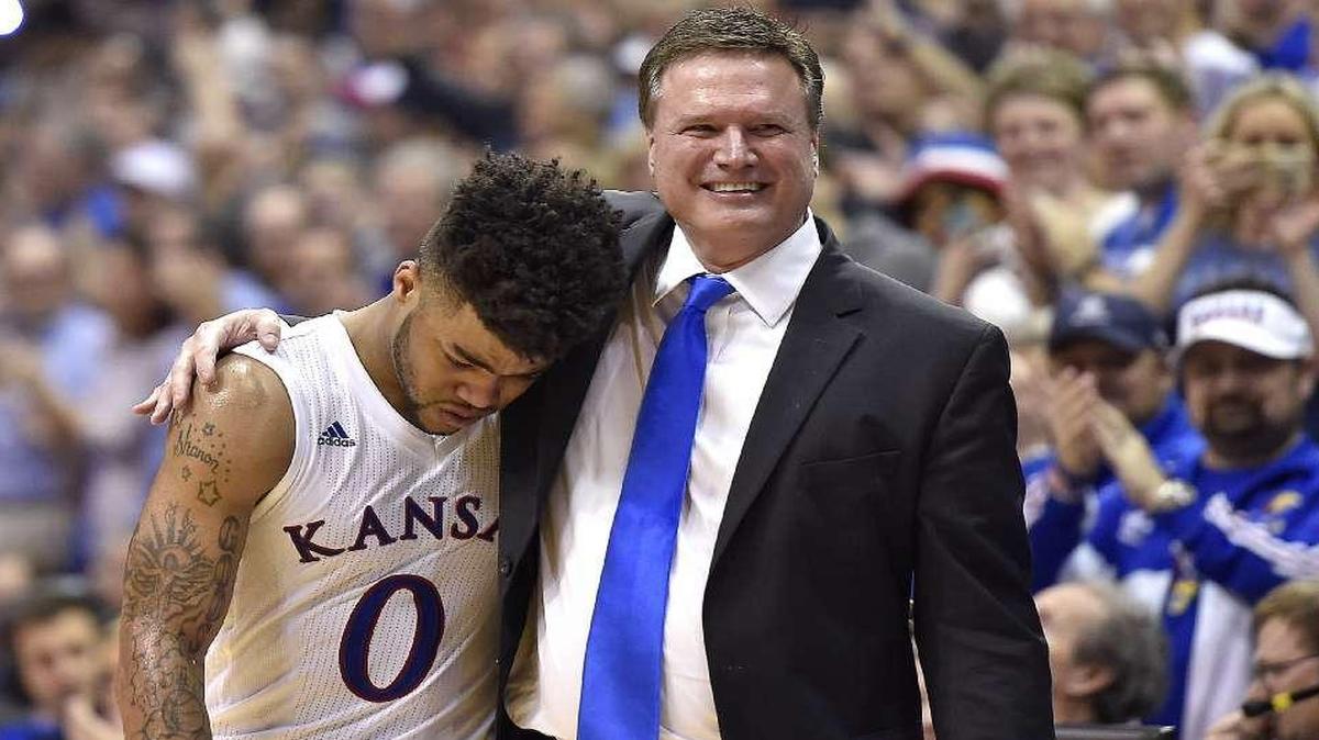 KU senior guard Frank Mason (left) was embraced by coach Bill Self after leaving the Jayhawks’ 73-63 victory over Oklahoma on Monday night at Allen Fieldhouse.