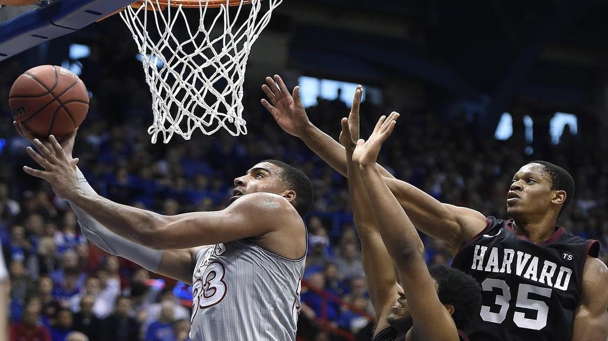 KU and Landen Lucas (left) beat Harvard 75-69 on Saturday at Allen Fieldhouse.