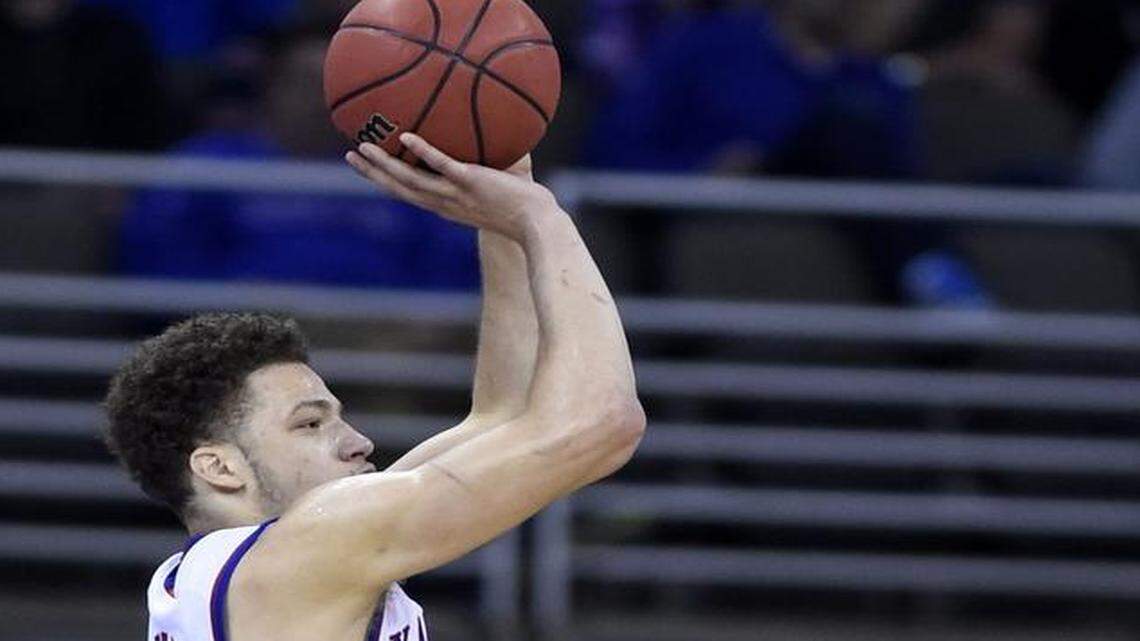 
KU’s Brannen Greene (left) is expected to return to basketball in four months following surgery to repair a torn labrum in his right hip on Thursday morning.
