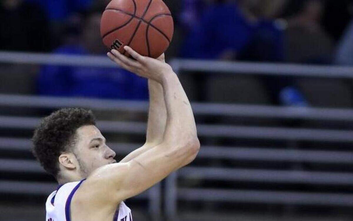 
KU’s Brannen Greene (left) is expected to return to basketball in four months following surgery to repair a torn labrum in his right hip on Thursday morning.
