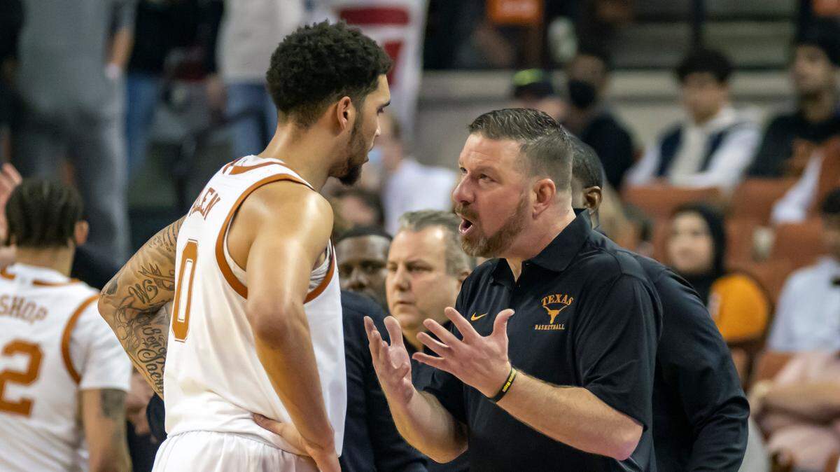 Texas head coach Chris Beard talks with forward Timmy Allen during the first half of a game, Saturday, Jan. 22, 2022, in Austin, Texas. Texas won 56-51.