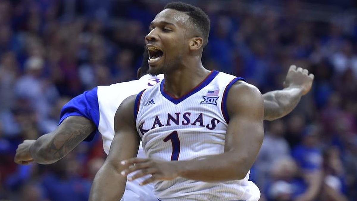 KU's Wayne Selden, who had a game high 22 points got the Jayhawks going with some hot shooting during the second half of Saturday night's game at the Sprint Center in Kansas City. He celebrated with teammate Jamari Traylor after OSU was forced to call another timeout. KU beat Oregon State, 82-67.