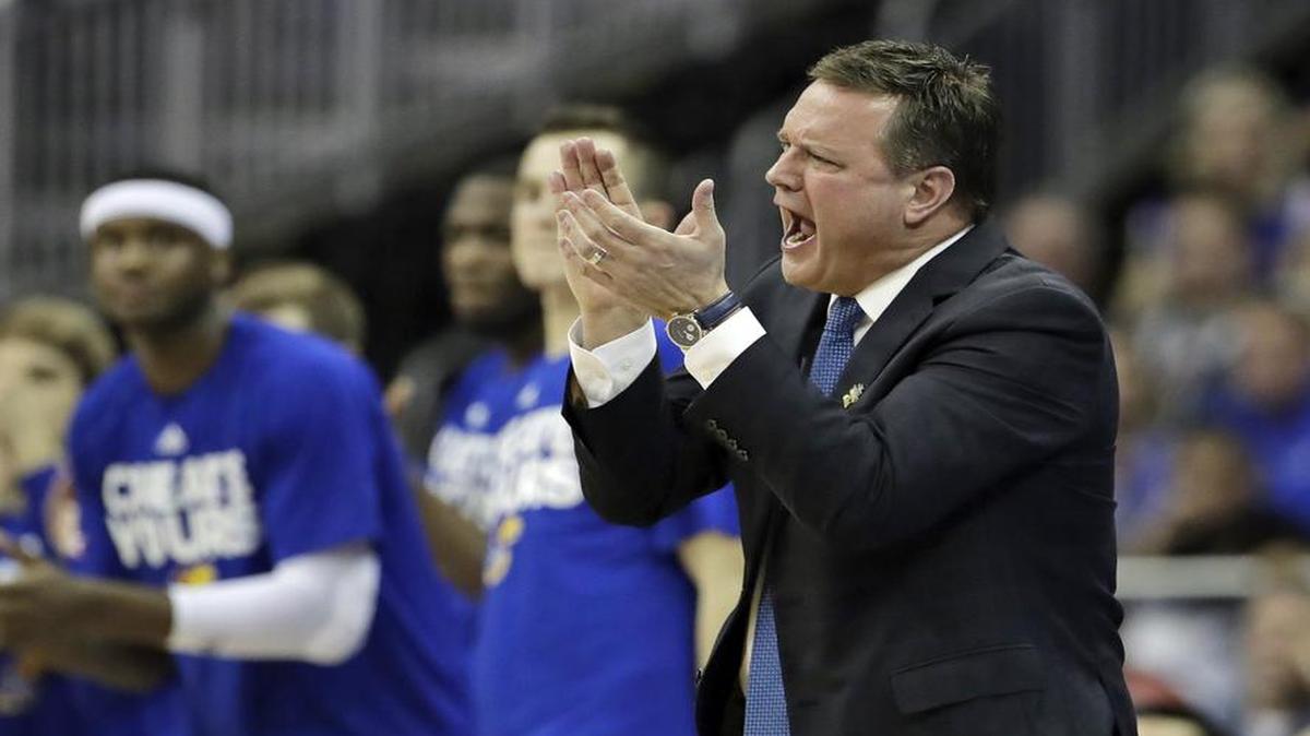 Kansas head basketball coach Bill Self (right)