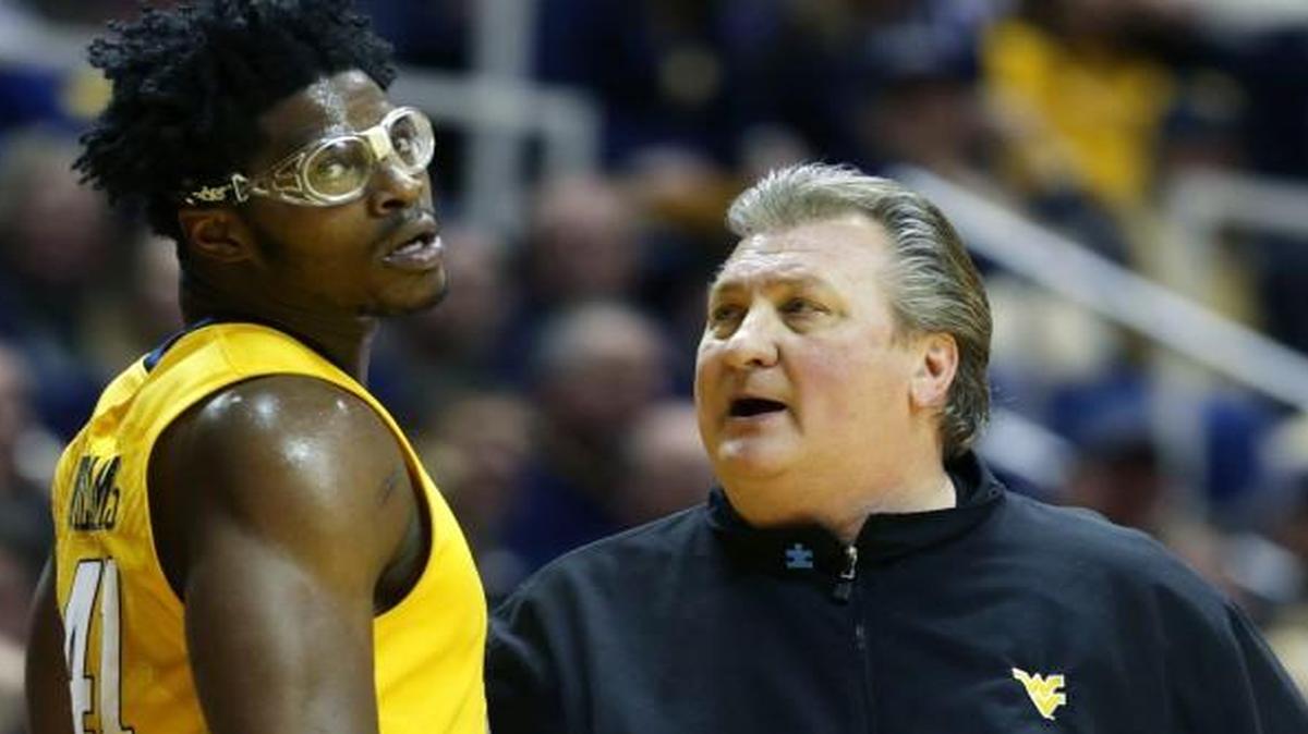 Tuesday night’s game against Kansas will be Bob Huggins’ 300th as West Virginia’s coach. Huggins (right) is pictured with forward Devin Williams (41) in the first half of the Mountaineers’ 80-69 victory over Baylor on Saturday in Morgantown, W.Va.
