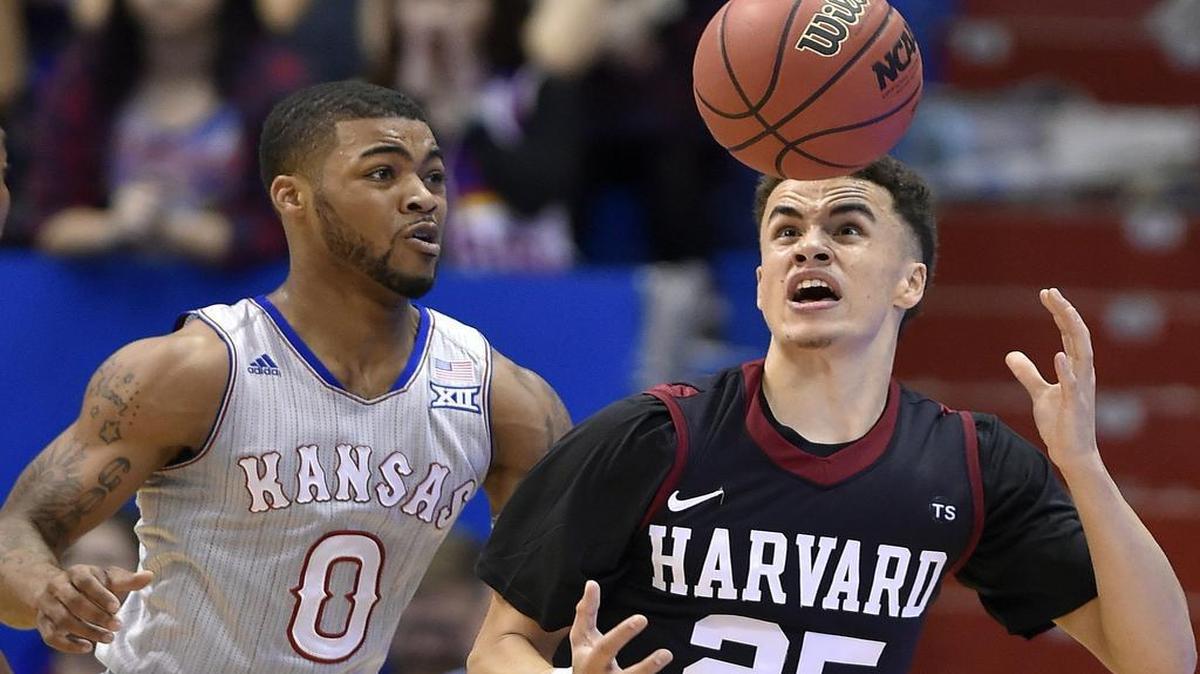KU’s Frank Mason (left) knocked the ball away from Harvard’s Corey Johnson during the first half of Saturday’s game at Allen Fieldhouse.