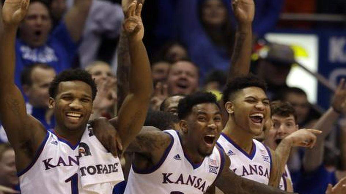
Kansas guard Wayne Selden Jr. (1), forward Jamari Traylor (31) and guard Kelly Oubre Jr. (12) celebrated a three-pointer by Evan Manning in the second half Saturday in KU’s 86-54 win over Texas Tech.


