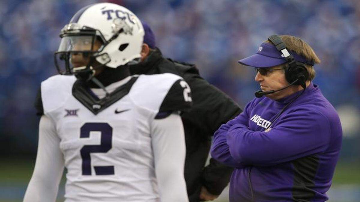 
TCU head coach Gary Patterson, right, and quarterback Trevone Boykin (2) stand on the side line during a play review in the first half of an NCAA college football game in Lawrence, Kan., Saturday, Nov. 15, 2014.
