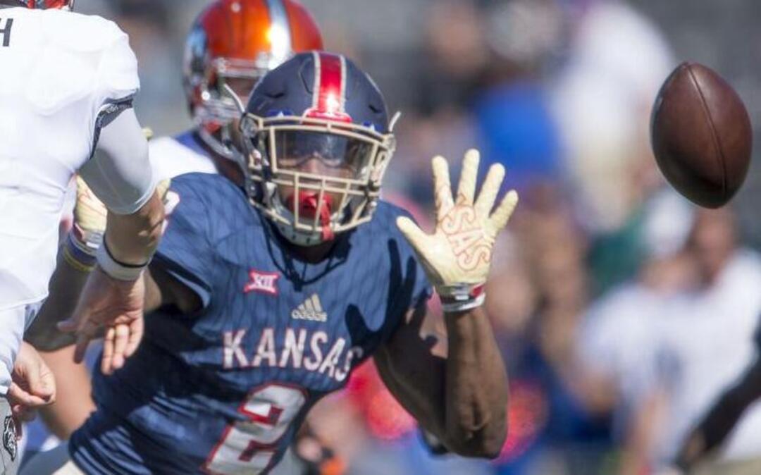 Kansas Jayhawks defensive end Dorance Armstrong (2) has transformed his body to 250 pounds in the offseason, adding weight and maintaining it with help from strength coaches and nutritionists. He gained national attention with 10 sacks last season.