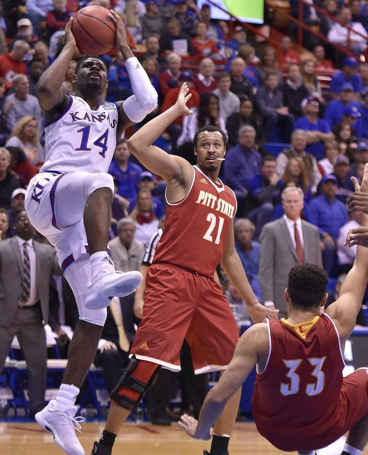 KU’s Malik Newman (14) drove between Pitt State’s Xavier Adams (21) and Christian Edmondson for a shot during the first half of an Oct. 31 exhibition game at Allen Fieldhouse.