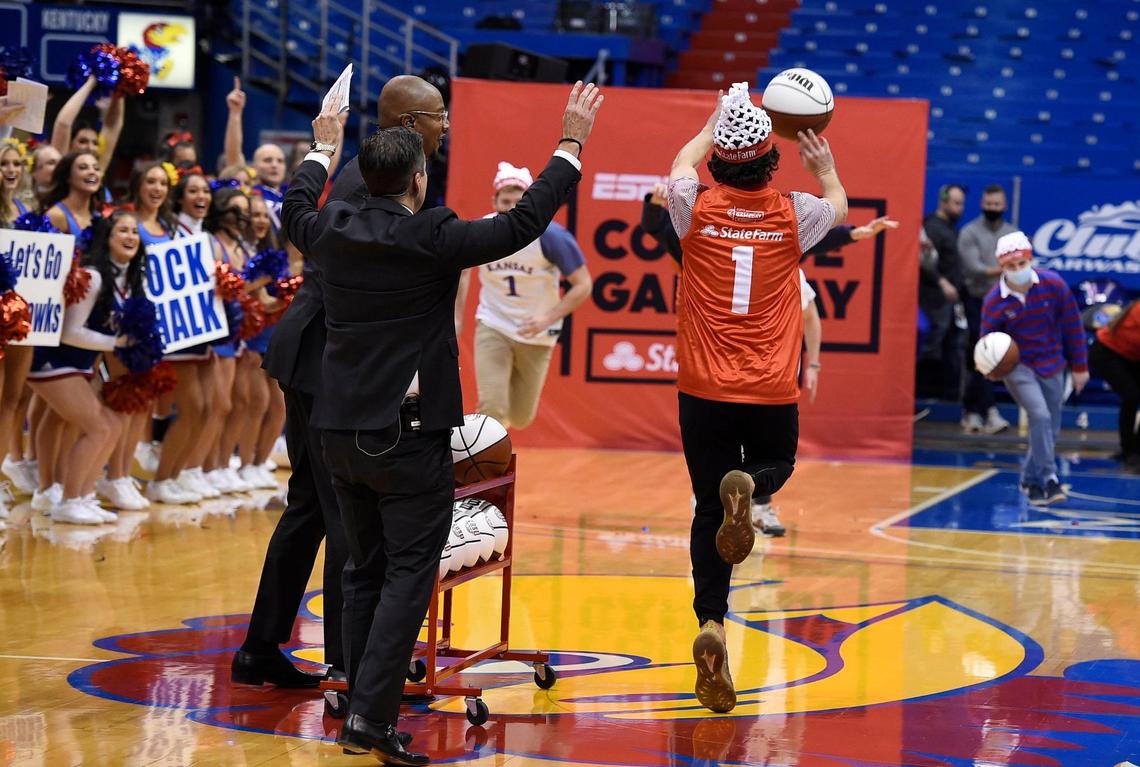 With everyone cheering him on, Connor Loney lets go of the half court shot that earned him $19,000 during ESPN’s College GameDay show Saturday morning at Allen Fieldhouse.
