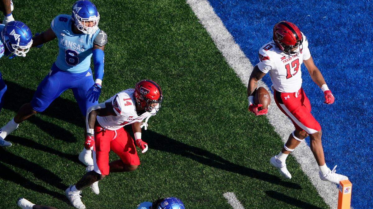 Texas Tech wide receiver Erik Ezukanma (13) runs into the end zone for a touchdown against Kansas during the second quarter of a game Saturday, Oct. 16, 2021, in Lawrence, Kan.