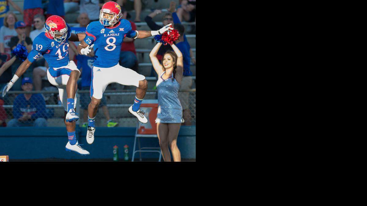
Kansas wide receivers Justin McCay (19) and Nick Harwell (8) celebrated after Harwell scored in the first quarter against Southeast Missouri State on Saturday night in Lawrence.
