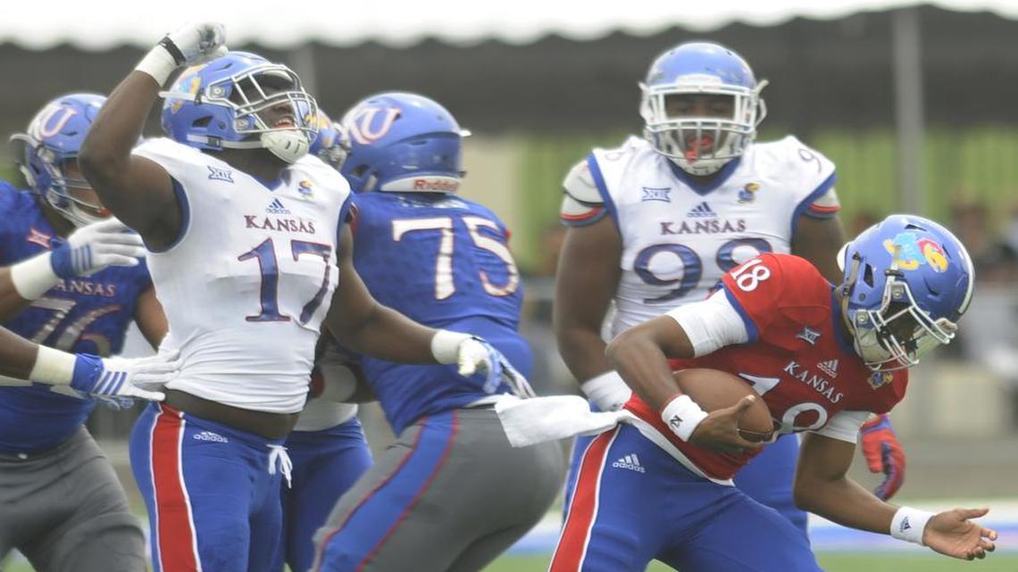 Defensive end Josh Ehambe pumped his fist after getting a sack of quarterback Tyriek Starks in Kansas’ spring game on Saturday at Memorial Stadium.