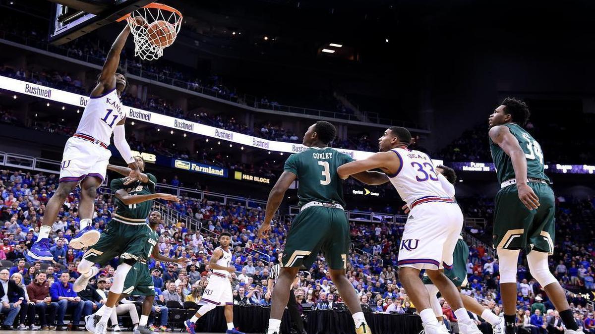 KU's Josh Jackson threw down an early dunk after getting by UAB's Dirk Williams during the first half of Monday night's CBE Classic semi-final game at the Sprint Center.