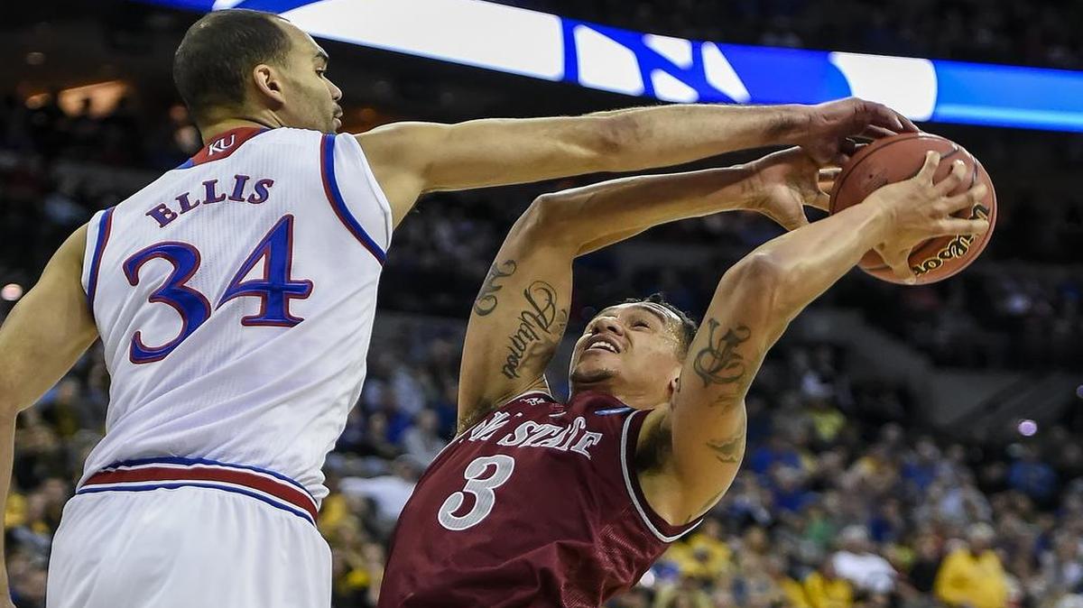 
Kansas Jayhawks forward Perry Ellis blocked the path to the basket of New Mexico State’s Remi Barry during the NCAA Tournament.
