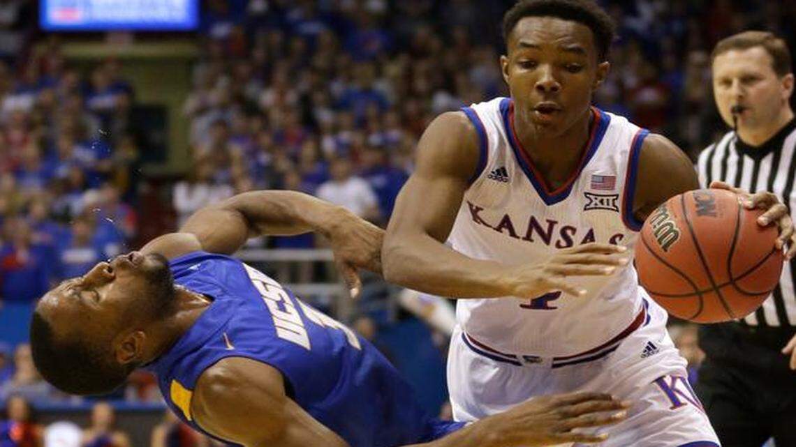 
Kansas guard Devonte Graham (right) was called for a foul against U-C Santa Barbara guard Zalmico Harmon during Friday’s basketball game in Lawrence.
