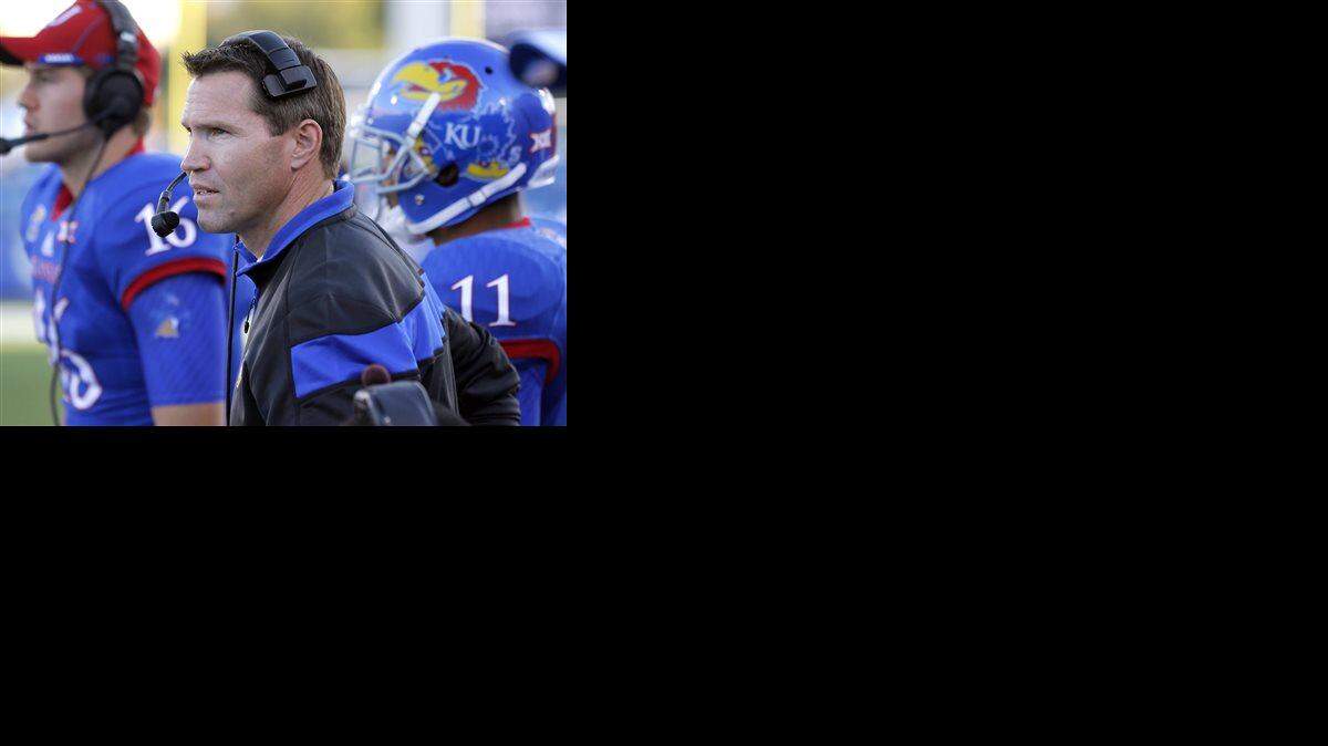 
Kansas interim head coach Clint Bowen watches from the sidelines during the second half of an NCAA college football game against Oklahoma State in Lawrence, Kan., Saturday, Oct. 11, 2014. Oklahoma State won 27-20. (AP Photo/Orlin Wagner)

