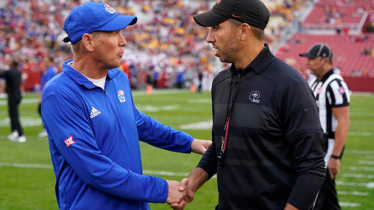 Kansas Jayhawks coach Lance Leipold, left, greets Iowa State Cyclones coach Matt Campbell on the field before last year’s KU-ISU game in Ames, Iowa.