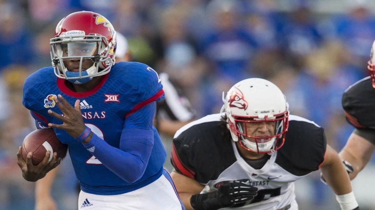 
Kansas Jayhawks quarterback Montell Cozart slipped away from Southeast Missouri State safety Eriq Moore during last year’s season opener.
