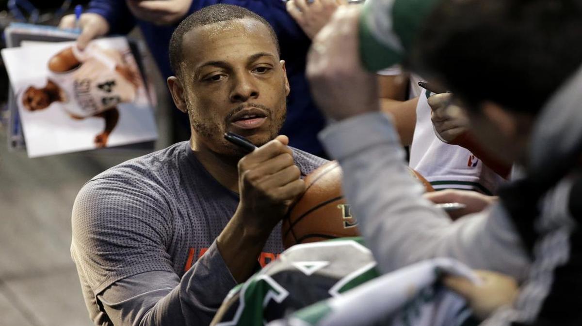 Paul Pierce, left, signed autographs for fans before a game against the Boston Celtics, Sunday, Feb. 5, 2017, in Boston.