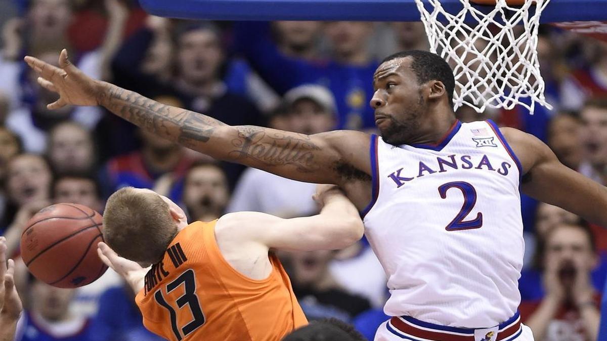 
KU’s Cliff Alexander went high to get a piece of a shot by Oklahoma State’s Phil Forte on Jan. 13 at Allen Fieldhouse in Lawrence, Kan. KU won 67-57.
