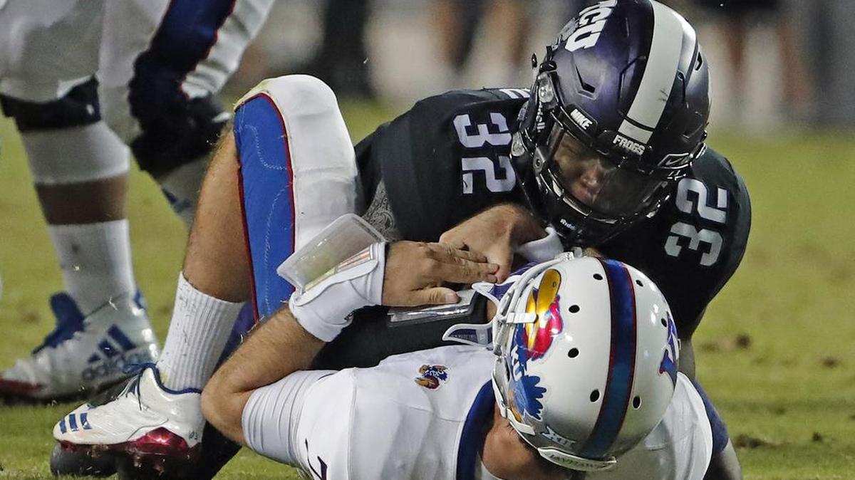 KU quarterback Peyton Bender was sacked by TCU linebacker Travin Howard in the second quarter at Amon G. Carter Stadium in Fort Worth, Texas on Saturday Oct. 21, 2017.