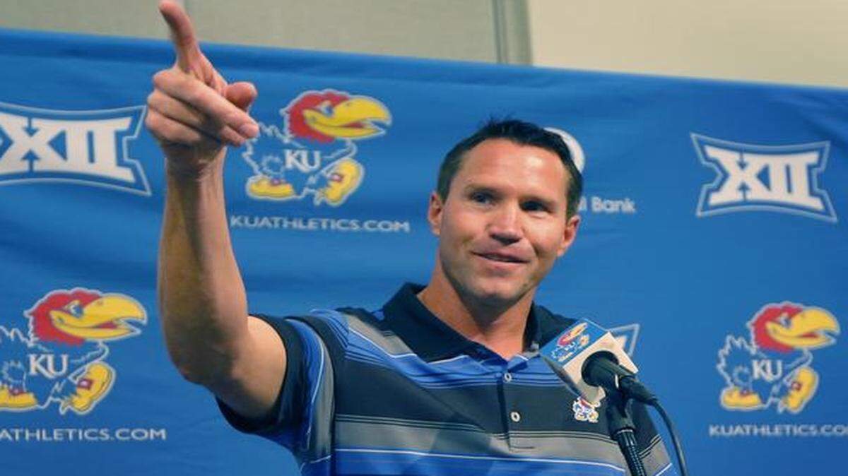 
Kansas interim head football coach Clint Bowen pointed to his wife while answering a question his news conference in Lawrence on Monday. Bowen replaces Charlie Weis, who was fired after Saturday’s 23-0 loss to Texas.

