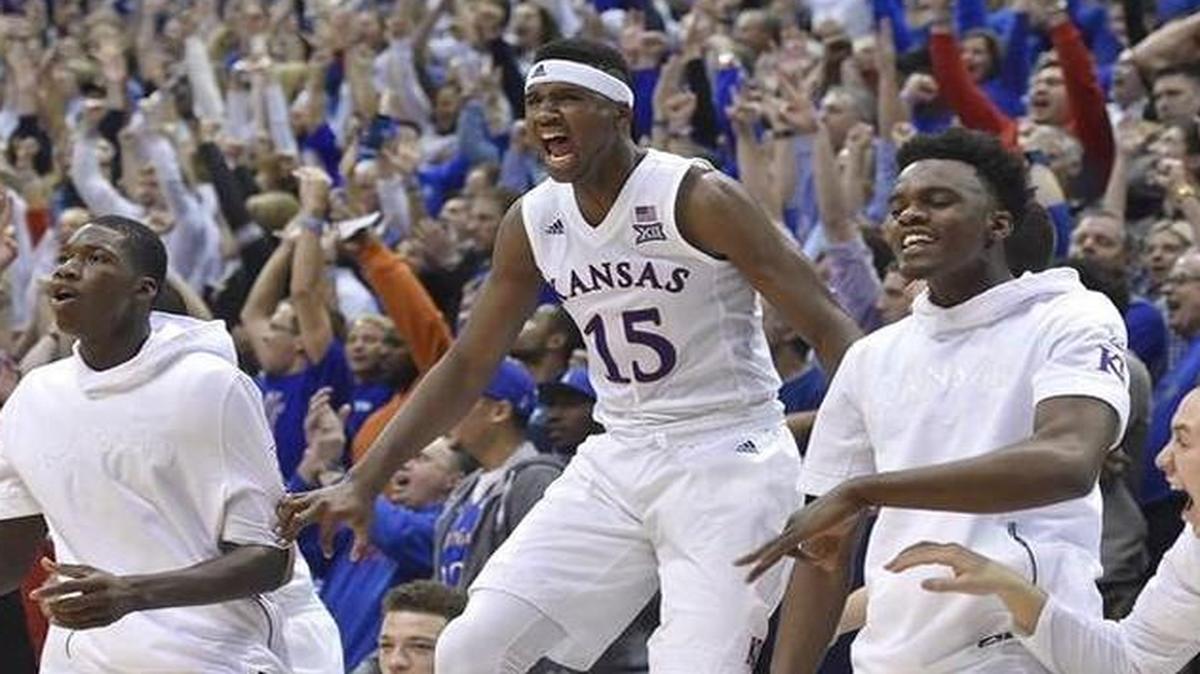 Freshman Carlton Bragg Jr. (No. 15) and the rest of the KU bench got excited after a Frank Mason three-pointer in the Jayhawks’ 90-84 overtime win over Kentucky on Saturday night at Allen Fieldhouse.