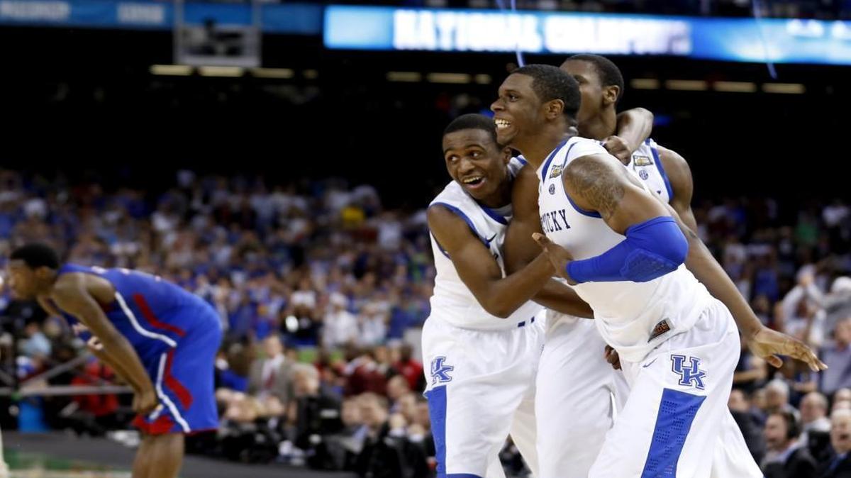 Kentucky’s Terrence Jones, Doron Lamb and Anthony Davis celebrated as Kansas Jayhawks guard Elijah Johnson (15) leaned on his knees after Kentucky beat KU in the 2012 NCAA title game.