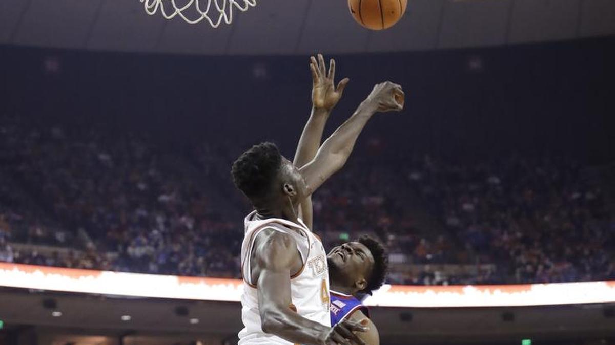 Texas’ Mohamed Bamba blocked a shot by Kansas’ Udoka Azubuike in the first half of Friday’s game in Austin, Texas. Bamba had eight blocks in the Jayhawks’ 92-86 victory.