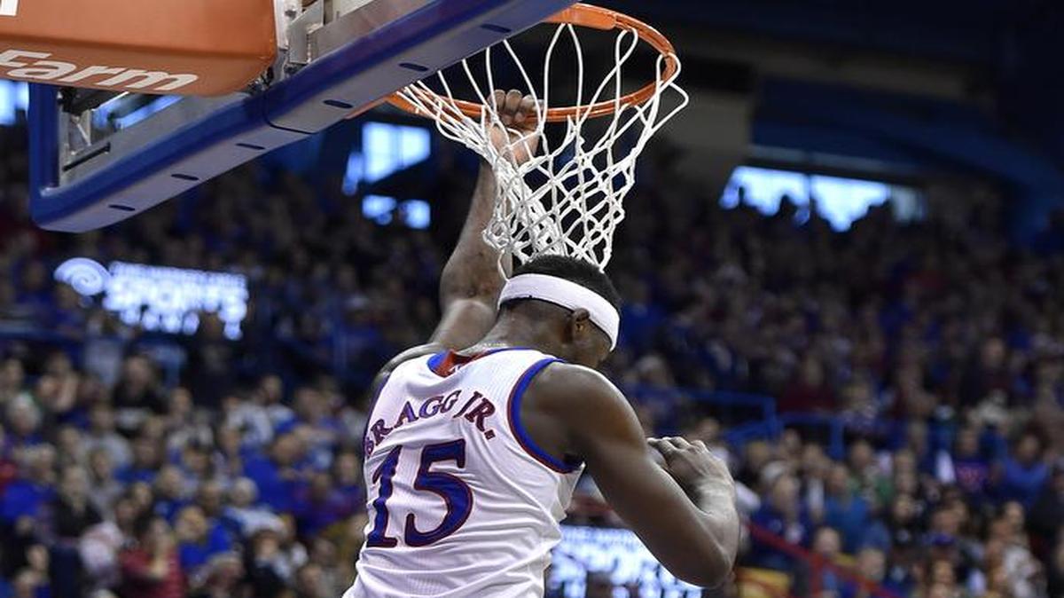KU's Carlton Bragg rocked the fieldhouse when he elevated voer Montana's Martin Breunig an finished an alley-oop dunk in spectacular fashion during the second half of Saturday's game at Allen Fieldhouse in Lawrence, Kans. KU beat Montana, 88-46.