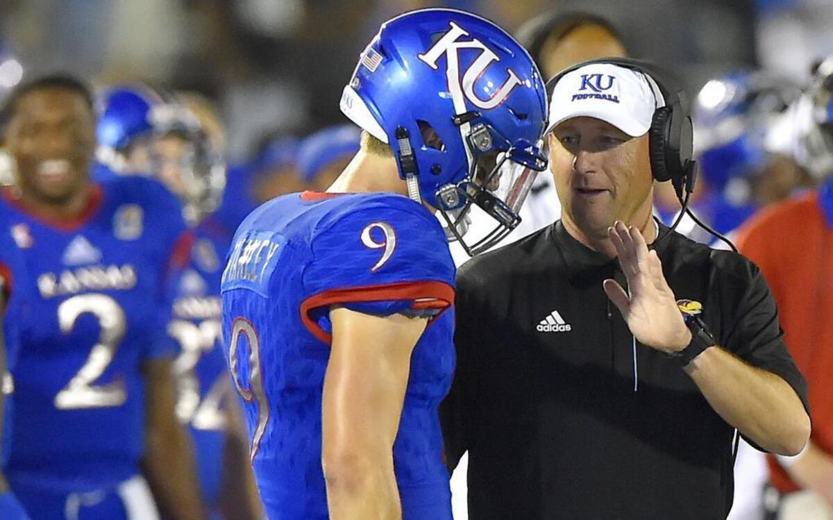 Jayhawks coach David Beaty talked to quarterback Carter Stanley during KU’s season opener against Rhode Island. Indications are that Beaty is going to be more open to ideas when it comes to the team’s weekly game plan.
