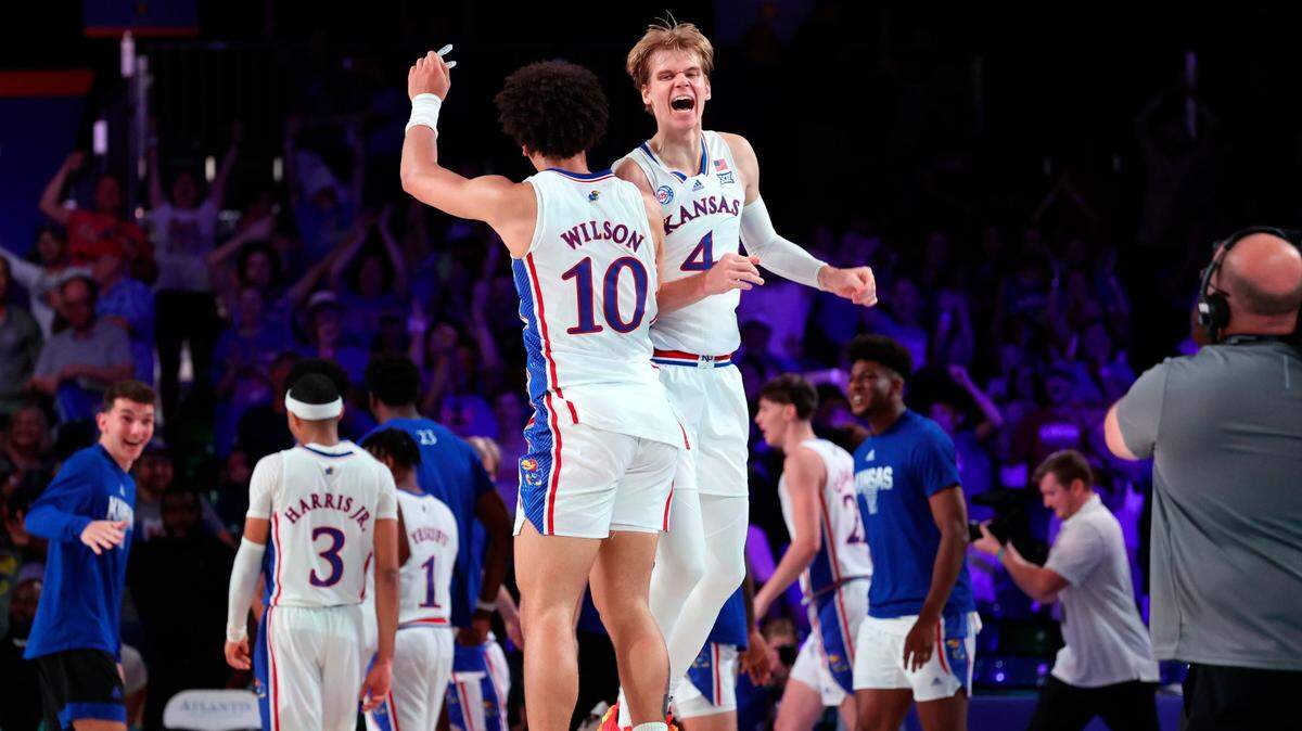 In a photo provided by Bahamas Visual Services, Kansas’ Jalen Wilson and Gradey Dick celebrate during a game against Wisconsin in the Battle 4 Atlantis at Paradise Island, Bahamas, on Nov. 24, 2022.