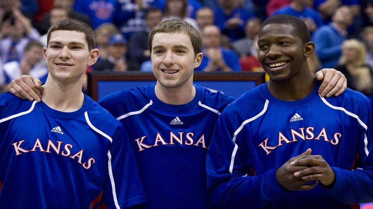 Brady Morningstar (center) with Tyrel Reed (left) and Mario Little on KU’s Senior Night in 2011 at Allen Fieldhouse.