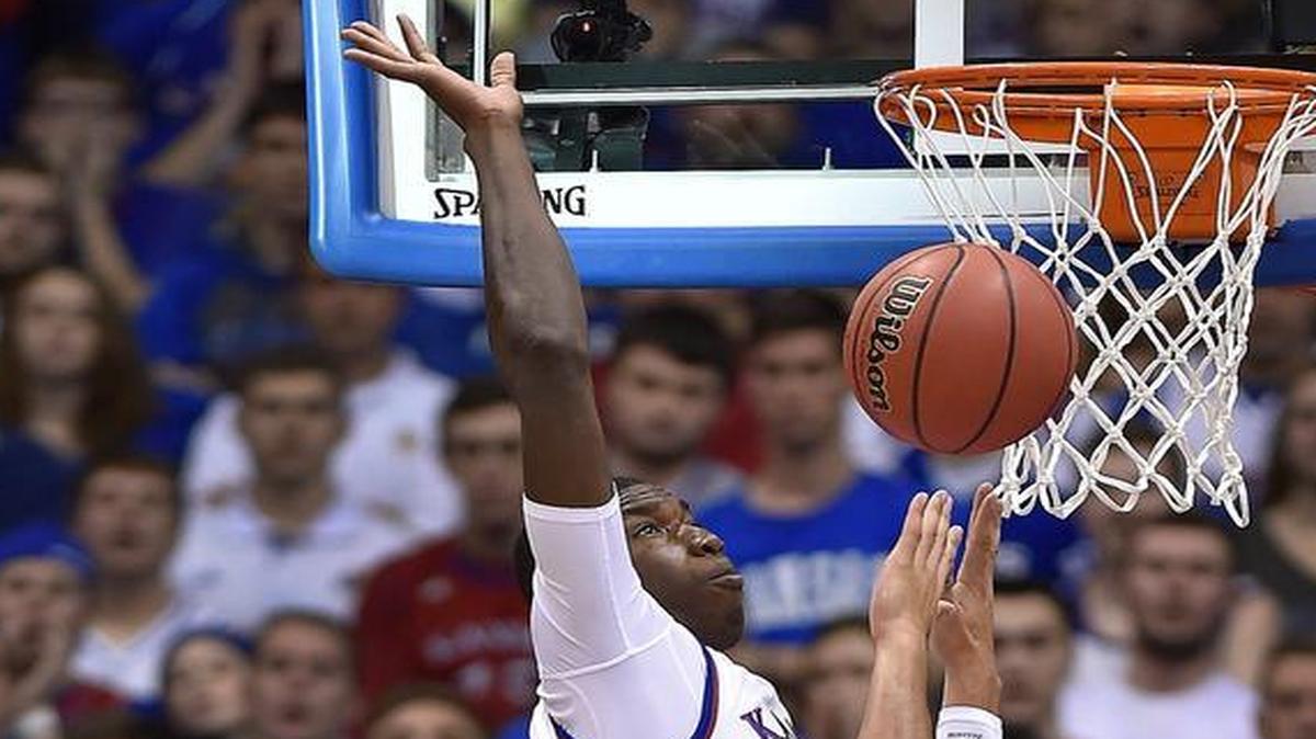 KU’s Cheick Diallo (center), Brannen Greene (left) and Landen Lucas put up a defensive wall against Baylor’s Al Freeman in Saturday’s game.