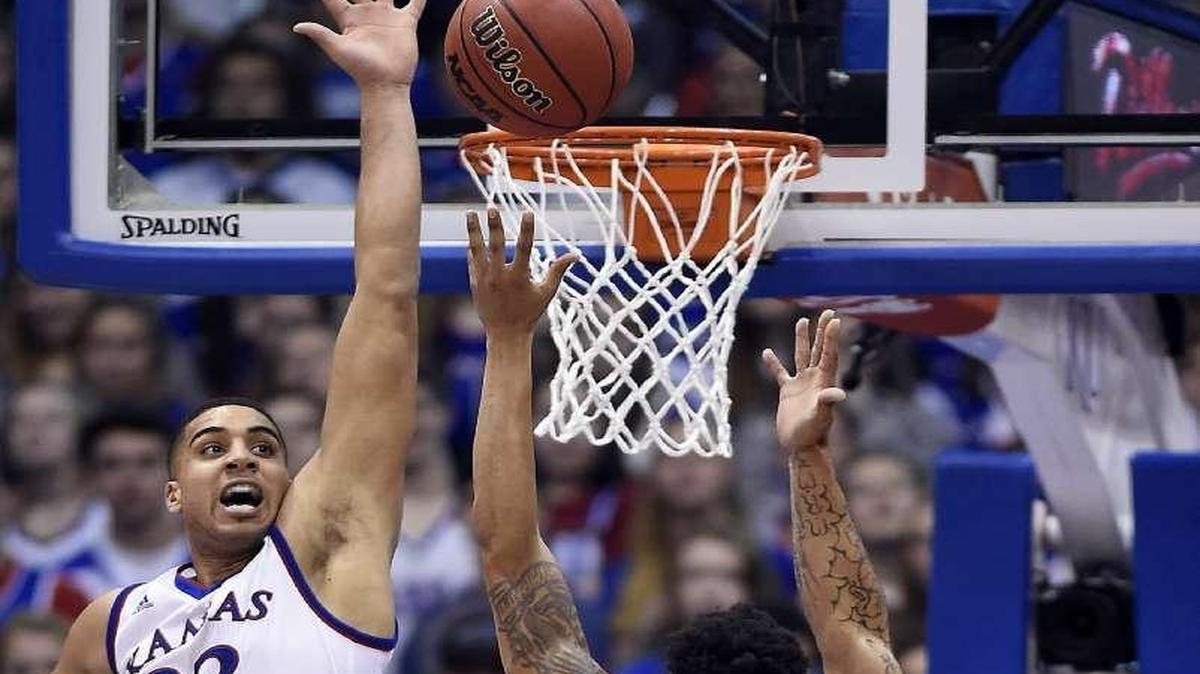 KU’s Landen Lucas (left) grabbed 14 rebounds against Texas and leads the Big 12 with 11.4 per league game.