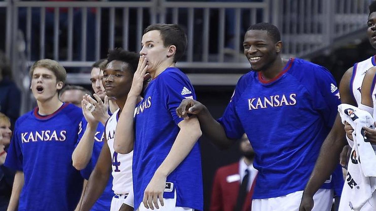 The KU bench, including Mitch Lightfoot (third from left), reacted to a Josh Jackson dunk during the first half of the Jayhawks’ 83-63 victory over UAB on Monday night in the CBE Classic semifinals at the Sprint Center.