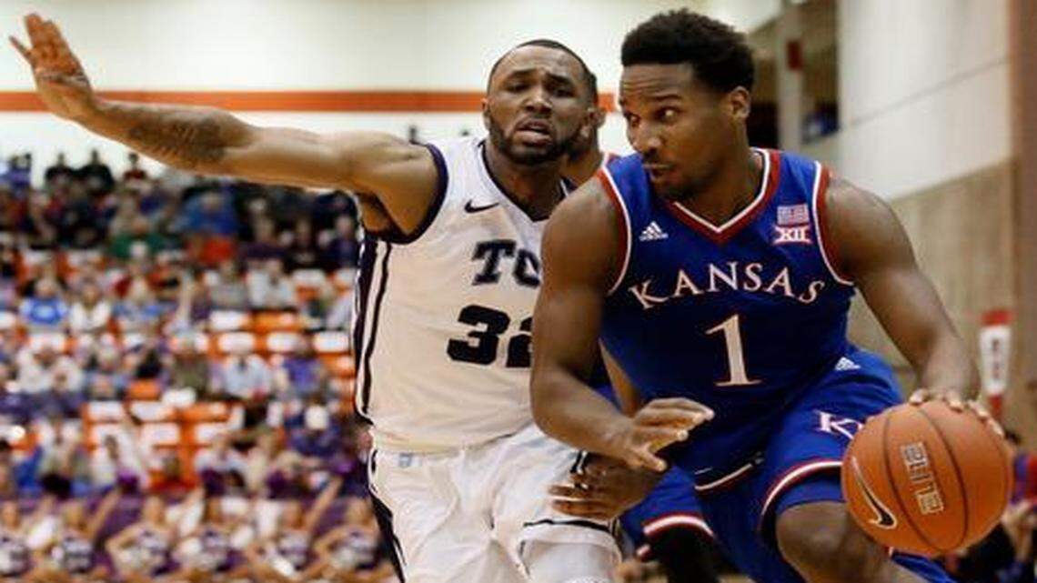 
TCU guard Trey Zeigler (32) defended as Kansas guard Wayne Selden (1) drove to the basket in the first half Wednesday night in Fort Worth, Texas. 
