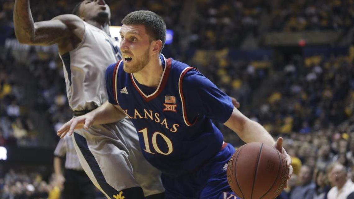 Kansas’ Sviatoslav Mykhailiuk (right) said “speed beats size every time, every day.” Mykhailiuk and the Jayhawks square off against a tall Texas A&M squad on Saturday.