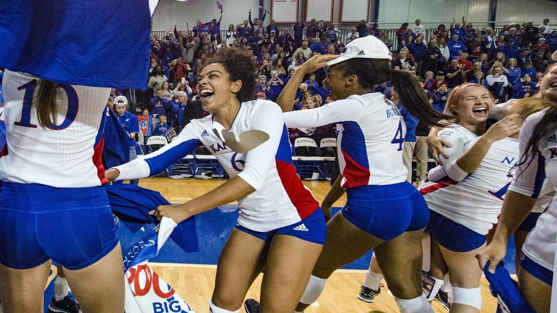 The Kansas Jayhawks women's volleyball team celebrated after defeating Iowa State on Saturday in Lawrence. The victory gave the Jayhawks at least a share of the regular-season title. The team draws a dedicated and rowdy fanbase to the small Horejsi Family Athletics Center next to Allen Fieldhouse.