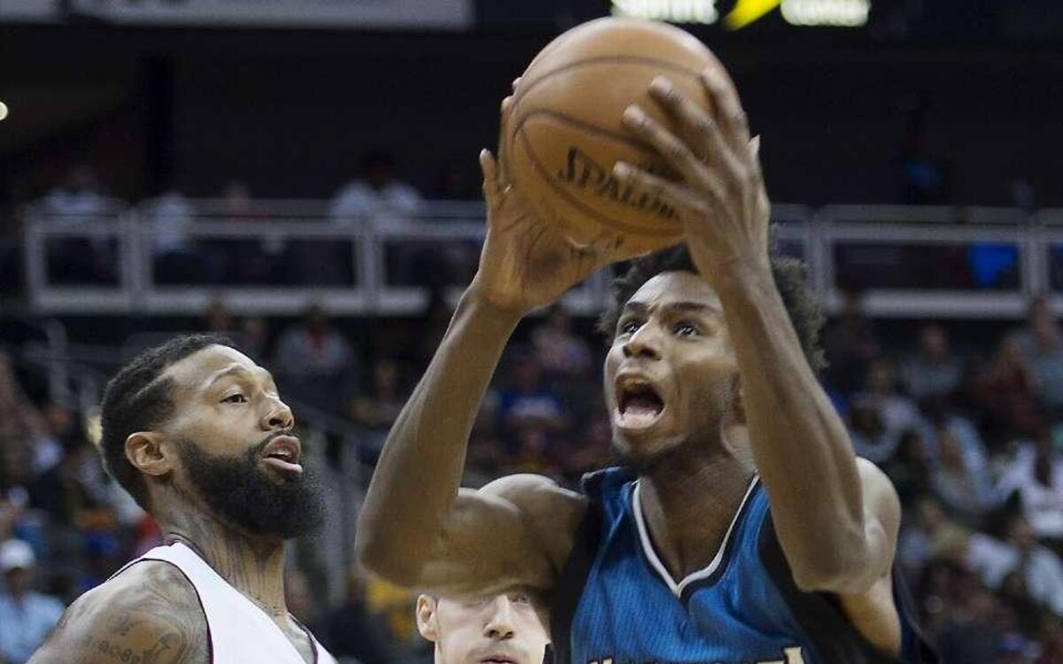 The Timberwolves’ Andrew Wiggins (right), who played at Kansas, shares some similarities with KU freshman Josh Jackson, according to Jayhawks coach Bill Self.